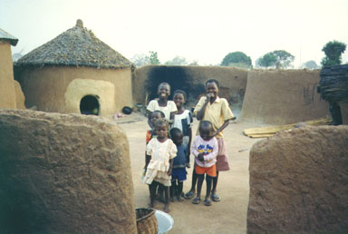  Bawku, Ghana, 1993. Typical style of housing in the North of Ghana. The children in the     picture are members of the Kussie tribe. Photo by Peace Corps Volunteer Wayne Breslyn.