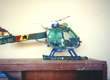 Bawku, Ghana, 1994. Children showed the most amazing creativity. This helicopter  was made from Sprite bottles, toothpaste caps and discarded metal.  Photo by Peace Corps Volunteer Wayne Breslyn.